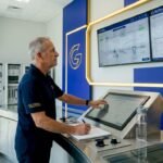Engineer monitoring HMI panel in control room